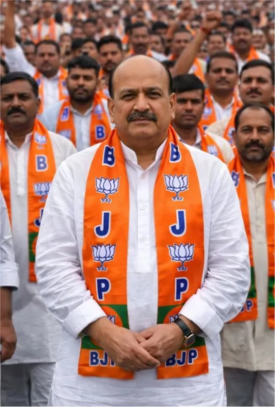 BJP Satin Phatka worn by a leader with supporters at a political gathering by Jhalak Enterprises.