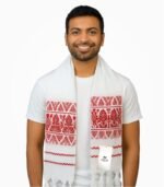 Indian male model wearing Assamese gamcha with red traditional embroidery on white base, smiling in white background