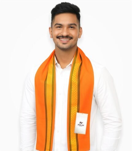 Indian male model wearing orange gamcha with yellow golden border, smiling in white studio background
