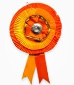 Orange and golden two-layer ribbon badge with central silver embellishment