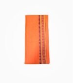 Neatly folded orange gamcha with traditional sanskar design