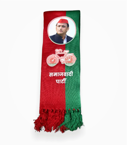 Folded red and green Samajwadi Party muffler with Akhilesh Yadav's photo and bicycle symbol.