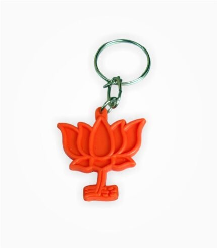 Orange lotus-shaped keychain with metallic ring on white background