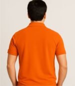 Back view of plain orange collared polo t-shirt worn by Indian male model