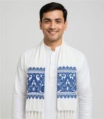 “Indian male model wearing Assamese white gamcha with blue floral design over white kurta”