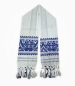 “Open Assamese gamcha with detailed blue woven floral border and cotton tassels”
