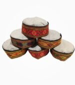 Stack of assorted Himachali caps with traditional multicolor embroidered bands.