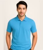 Young Indian man wearing a plain sky blue polo t-shirt in studio background