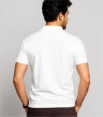 Back view of a young Indian male model wearing a white collared t-shirt