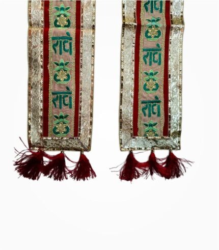 Close-up of Radhe Radhe Red Phatka showing embroidery and tassels