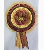 Close-up front view of zari ribbon badge purple cream rosette satin flower design with zari finish