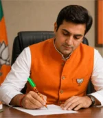 Political leader writing with BJP campaign pen
