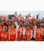 BJP rally crowd wearing saffron BJP premium muffler during political event
