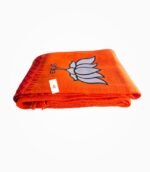 Folded BJP orange Rajwadi scarf with lotus print and woven cotton design